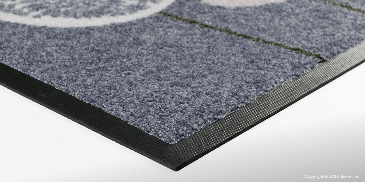 Grey colored mat with rubber back
